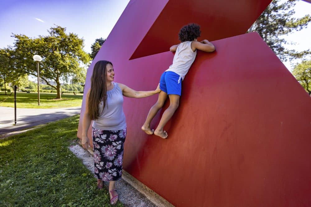 Flavia Peréa and her 9-year-old son play at MIT. Peréa has been trying for years to get a copy of a police report detailing an interaction between her then-6-year-old son and a classmate. (Jesse Costa/WBUR)