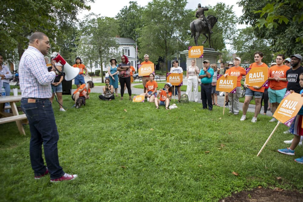 Raul Fernandez, a Massachusetts State Representative candidate, talks to supporters at a campaign rally in Brookline. (Robin Lubbock/WBUR)