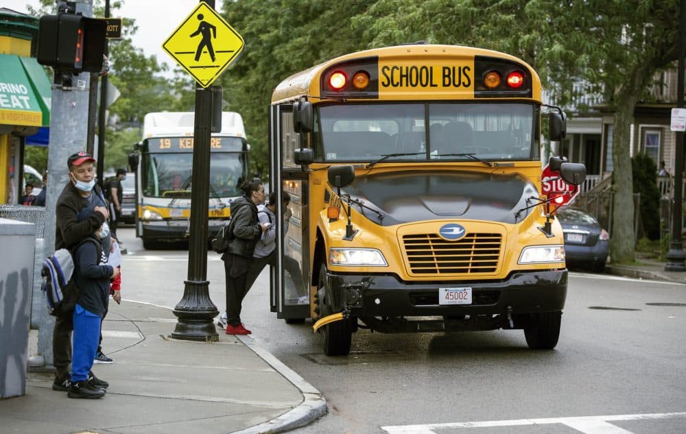 A school bus collects students on the first day of school in September 2021 in Dorchester. (Robin Lubbock/WBUR)