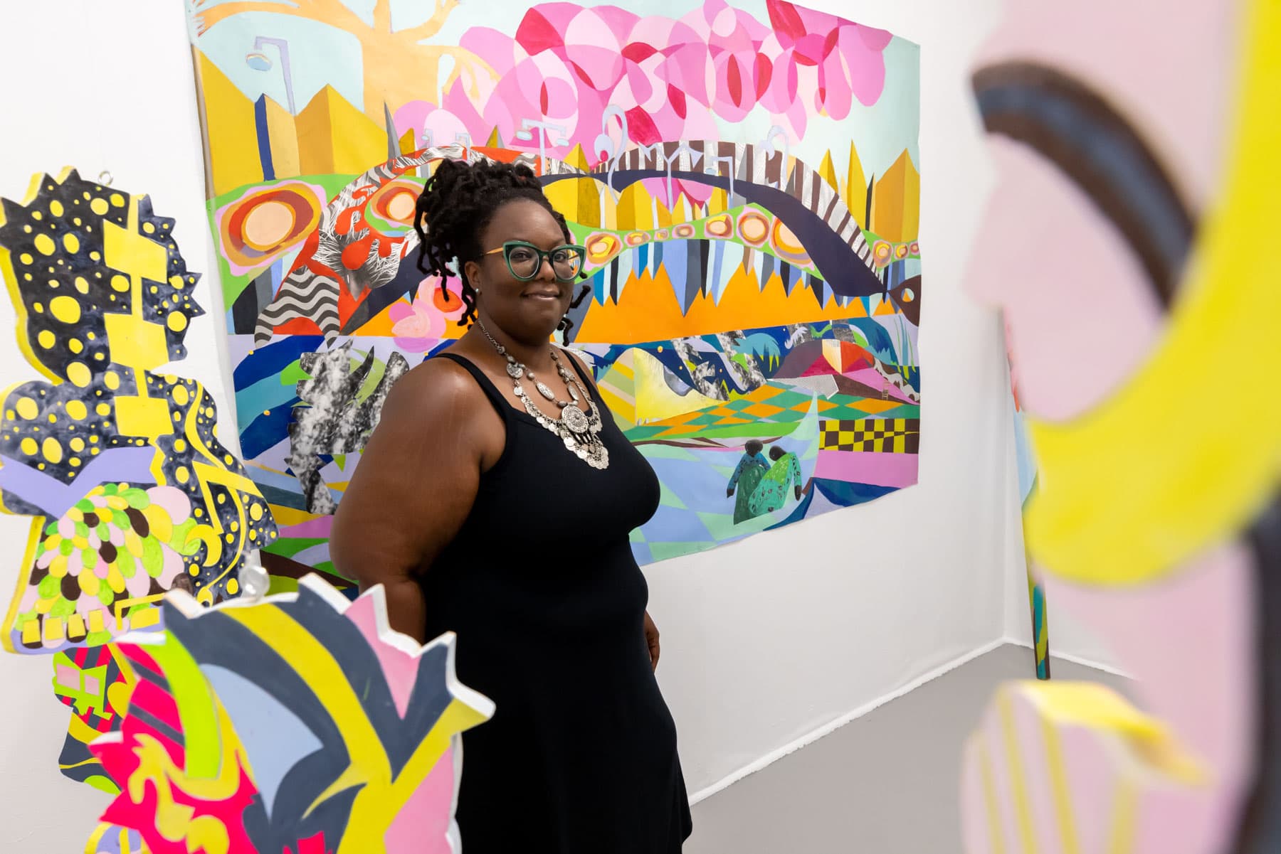 Karmimadeebora McMillan in front of her painting at Boston Center for the Arts’ new Project Room. (Courtesy Melissa Blackall Photography/ Boston Center for the Arts)
