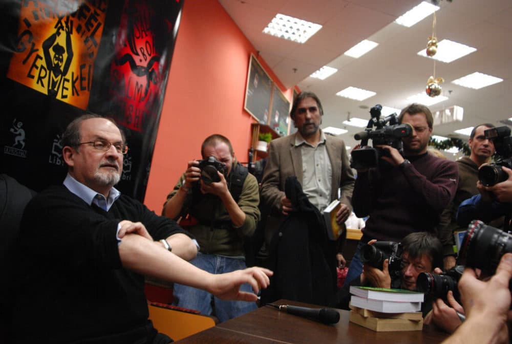 After publishing his fourth novel, The Satanic Verses, Rushdie was condemned to death by former Iranian spiritual leader Ayatollah Khomeini in early 1989, and he was forced into hiding. (AP Photo/Bela Szandelszky)