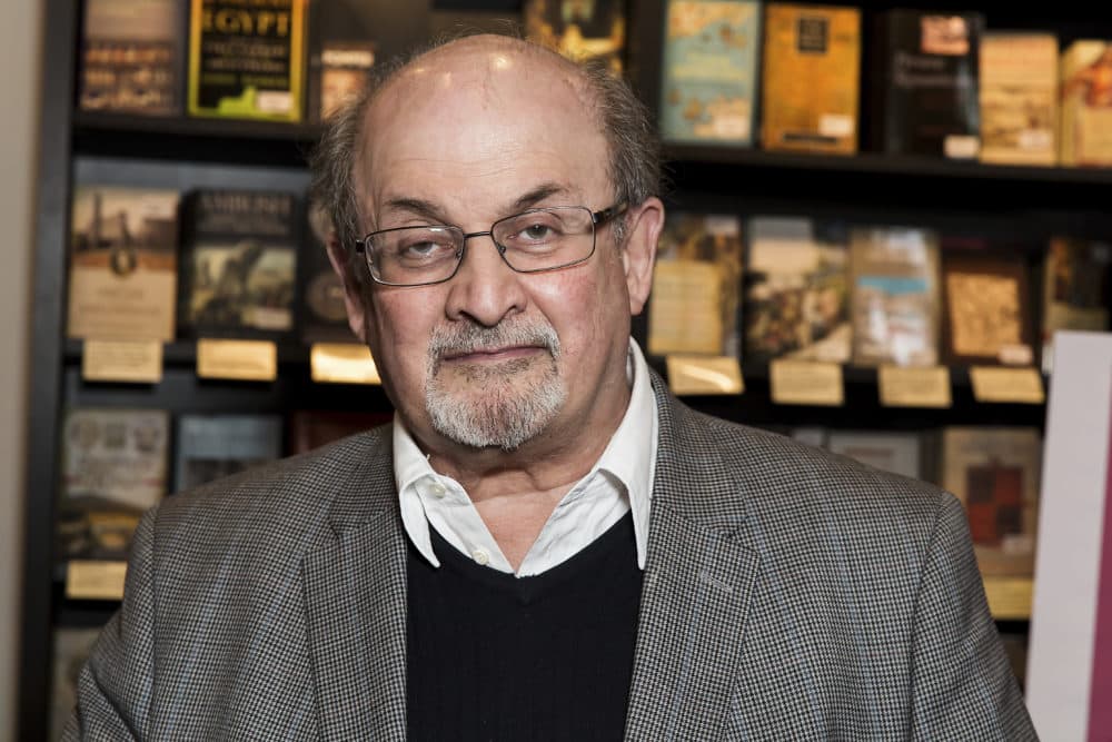Author Salman Rushdie poses for photographers at a book signing in London. (Grant Pollard/Invision/AP)