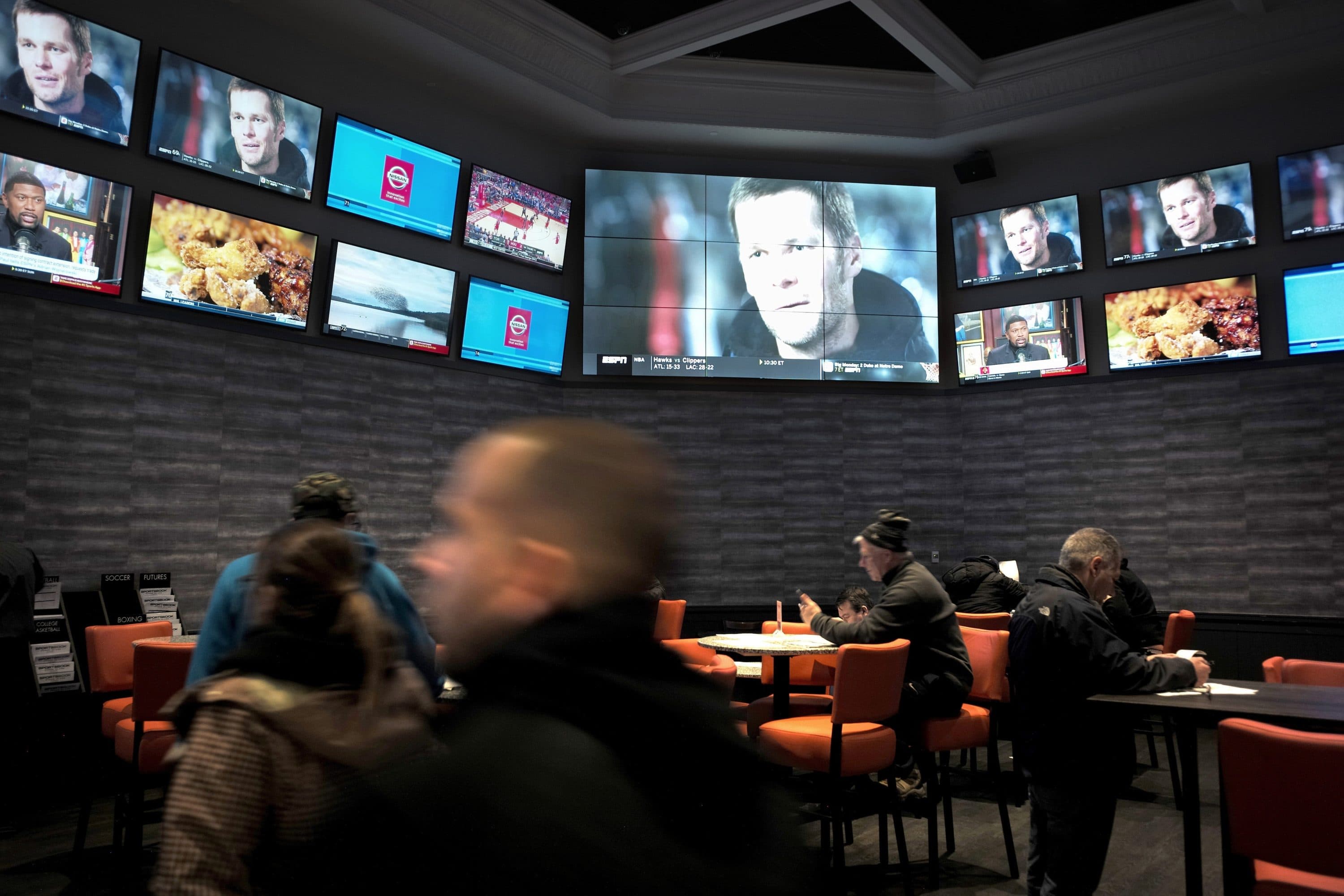 Patrons visit the sports betting area of Twin River Casino in Lincoln, Rhode Island. (Steven Senne/AP)