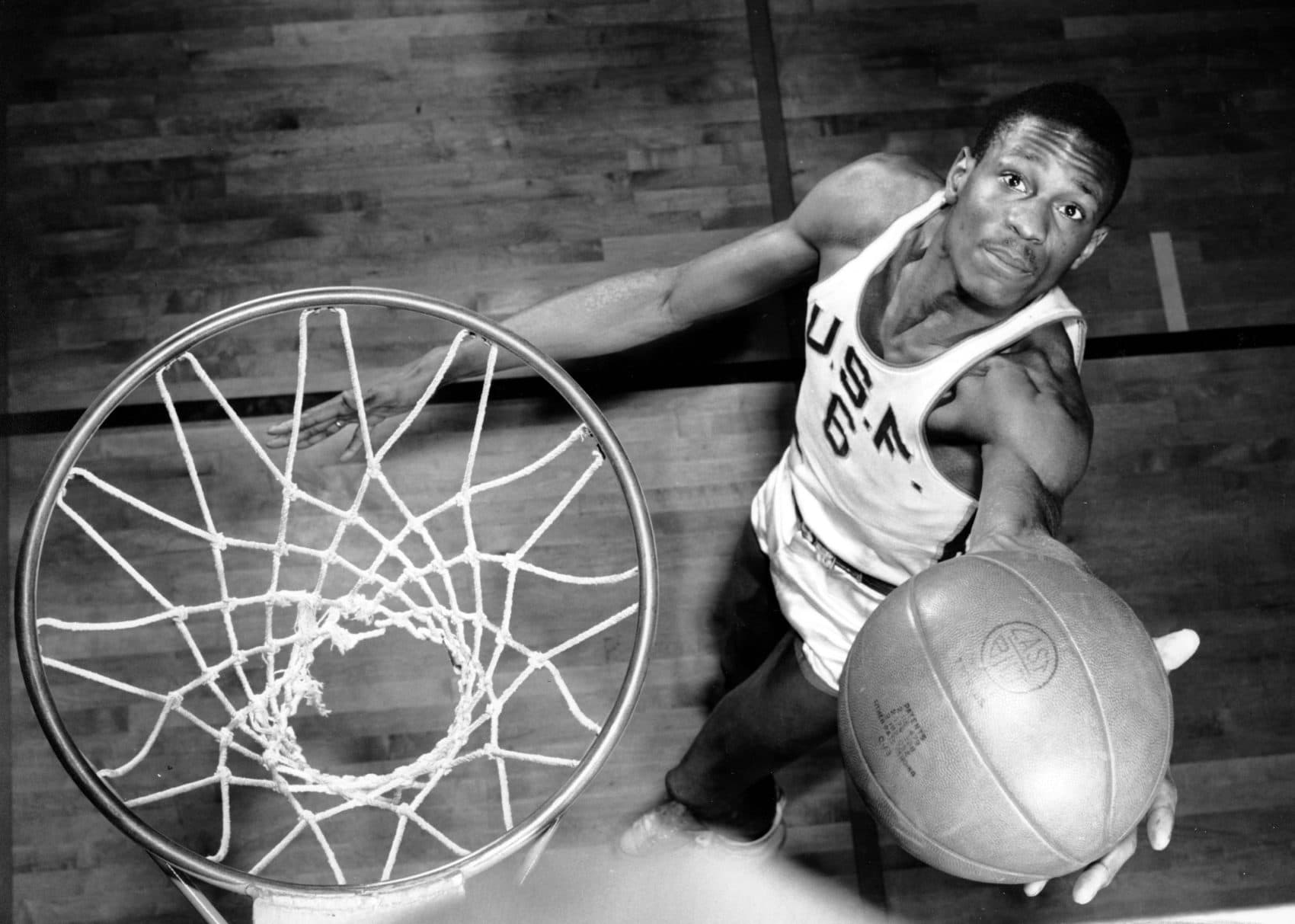 In this Feb. 23, 1956 photo, Bill Russell, a member of the University of San Francisco basketball team, shows how he scores baskets. (AP)