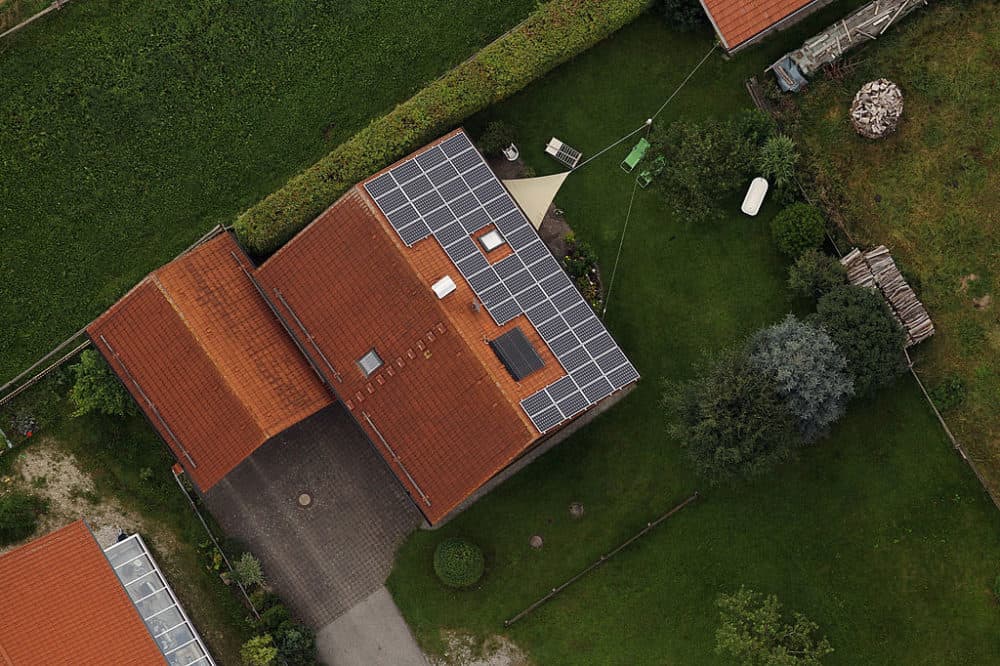 Aerial view shows photovoltaic panels on the roof of a building on August 11, 2010 near Peiting, Germany. energies. (Miguel Villagran/Getty Images)