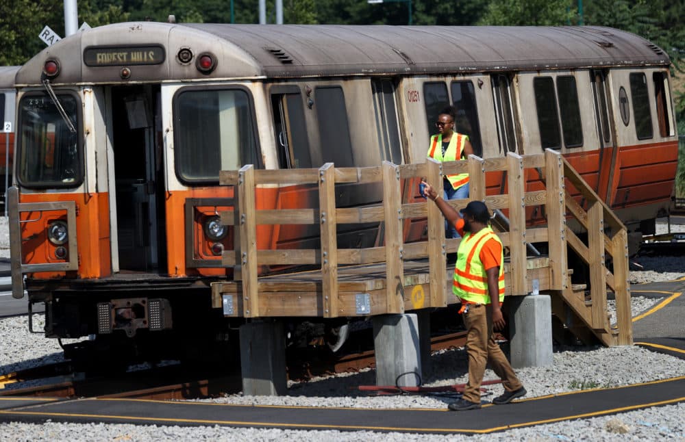 The MBTA Orange line is seen here at Wellington Station in Medford where inspectors looked over damage from a fire in early August. Passengers had to break windows and walk the tracks on the bridge to escape the blaze. One person jumped from the bridge into the river below. (David L. Ryan/The Boston Globe via Getty Images)