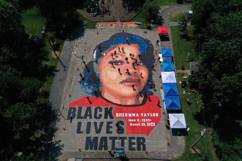 In an aerial view from a drone, a large-scale ground mural depicting Breonna Taylor with the text 'Black Lives Matter' is seen being painted at Chambers Park on July 5, 2020 in Annapolis, Maryland. (Patrick Smith/Getty Images)