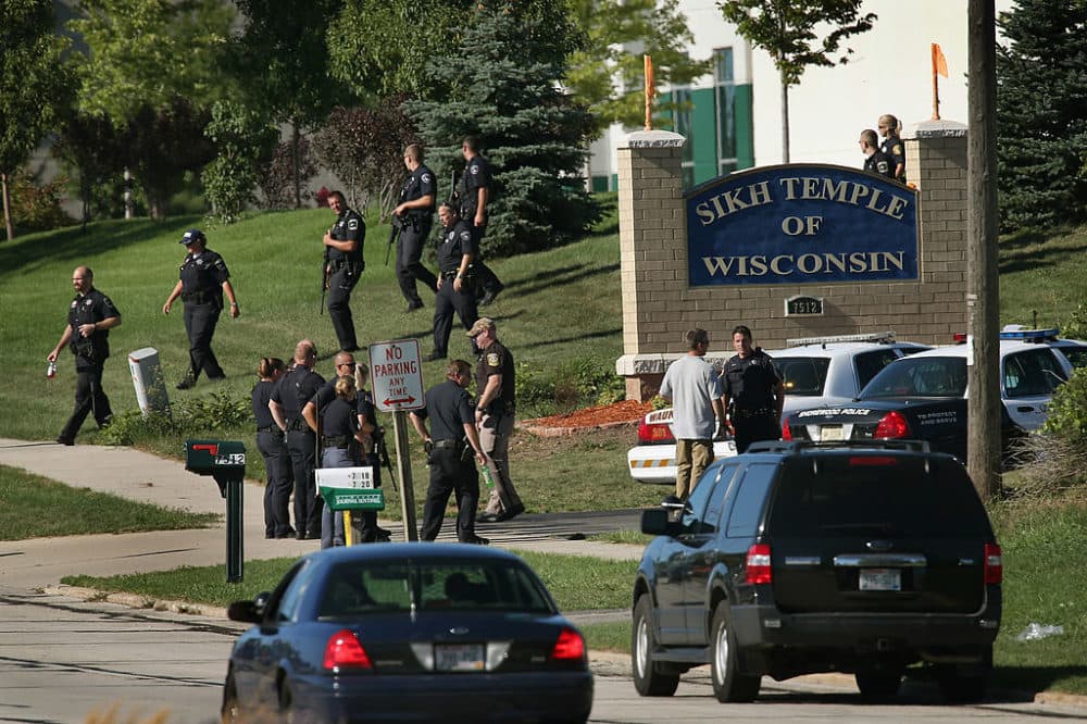 Police work outside the Sikh Temple of Wisconsin where a gunman stormed the mass and opened fire August, 5, 2012 Oak Creek, Wisconsin. (Scott Olson/Getty Images)