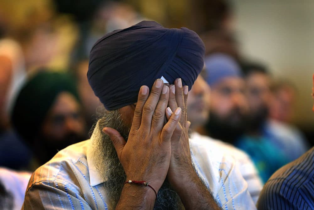 A member of the Milwaukee area Sikh community weeps as he listens to information about the shooting spree of Aug. 5, 2012 in Oak Creek, Wisconsin. (Scott Olson/Getty Images)