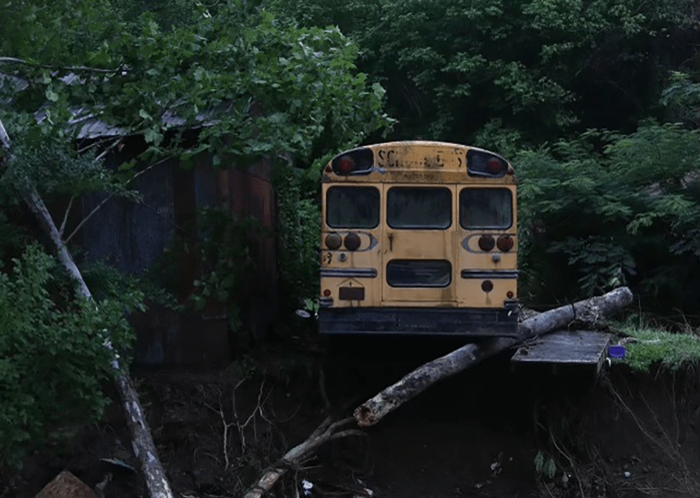 A bus stands abandoned in the flooding devastation. (Joe Arvin)
