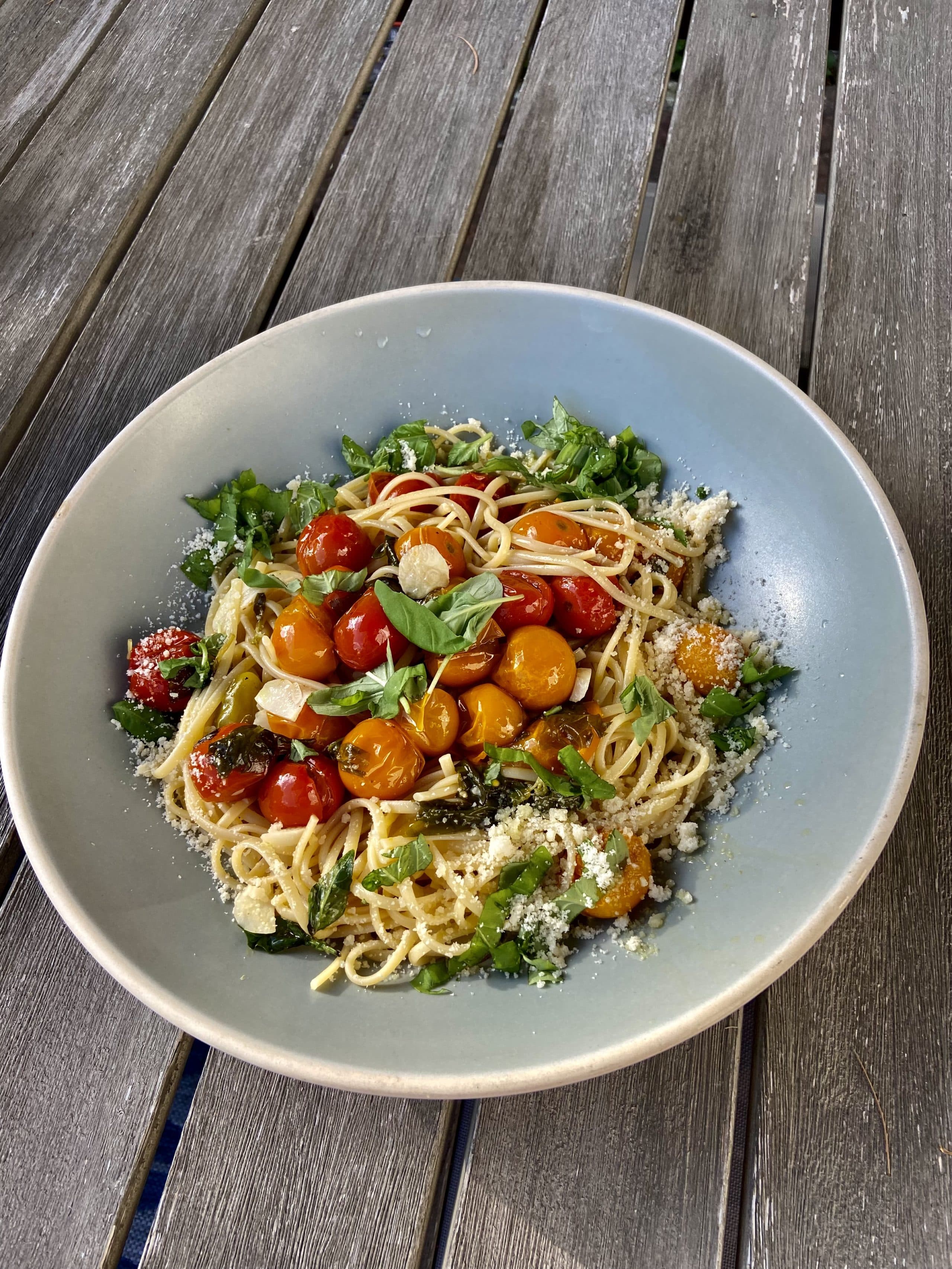Linguine with cherry tomato confit, basil, pine nuts and arugula. (Kathy Gunst/Here &amp; Now)