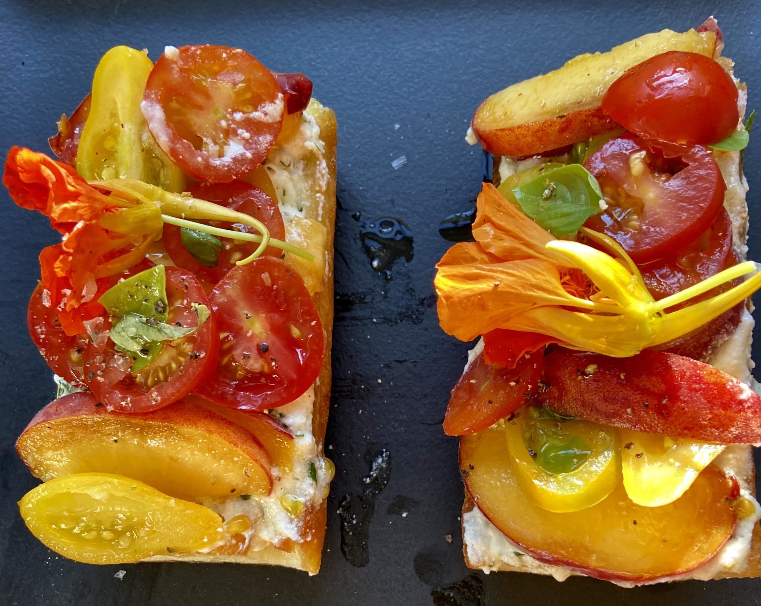 Heirloom tomato, peach, and herbed lemon ricotta tartine.  (Kathy Favor/Here & Now)