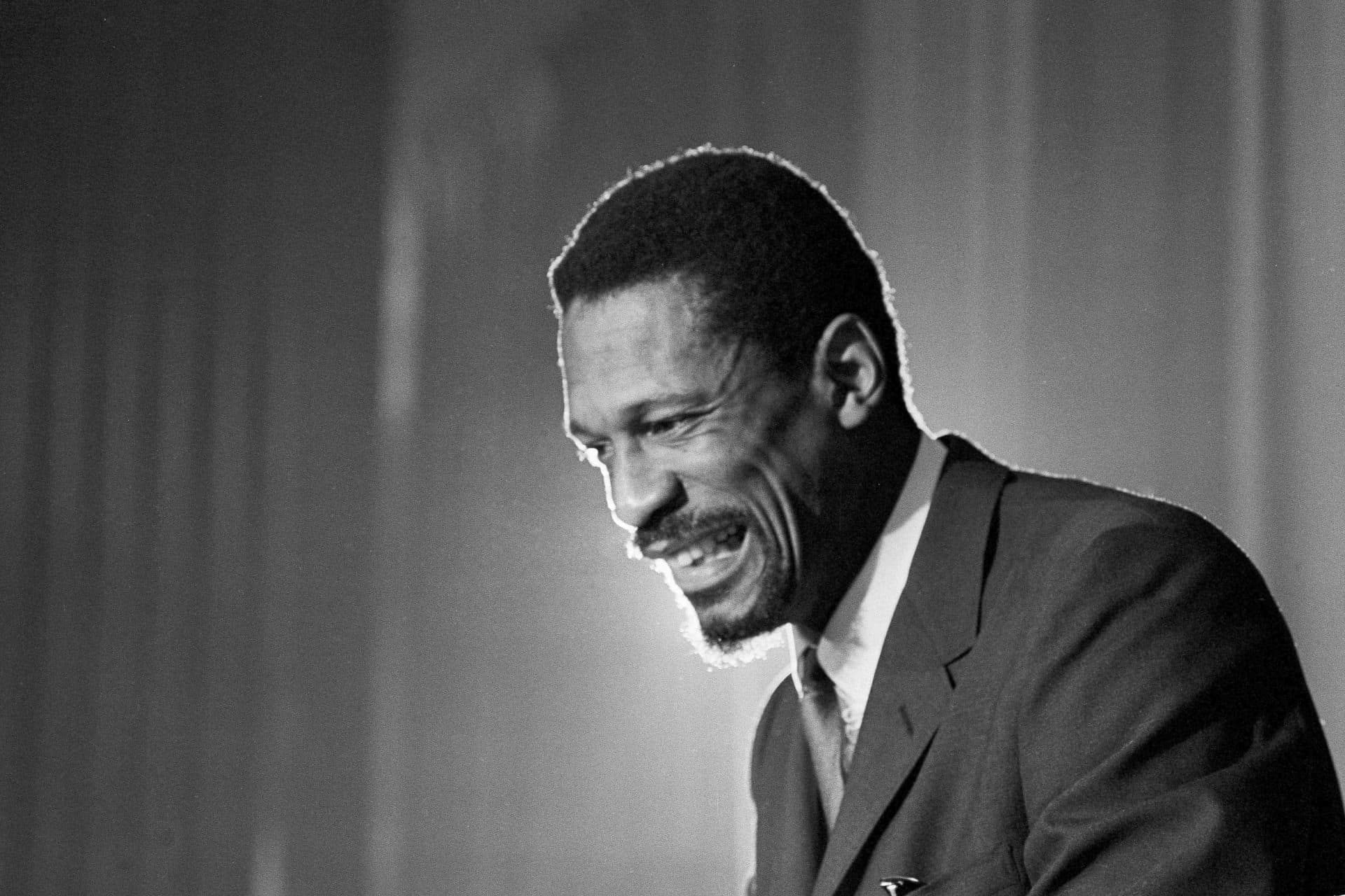 Bill Russell grins at announcement that he had been named coach of the Boston Celtics basketball team on April 18, 1966. (AP)