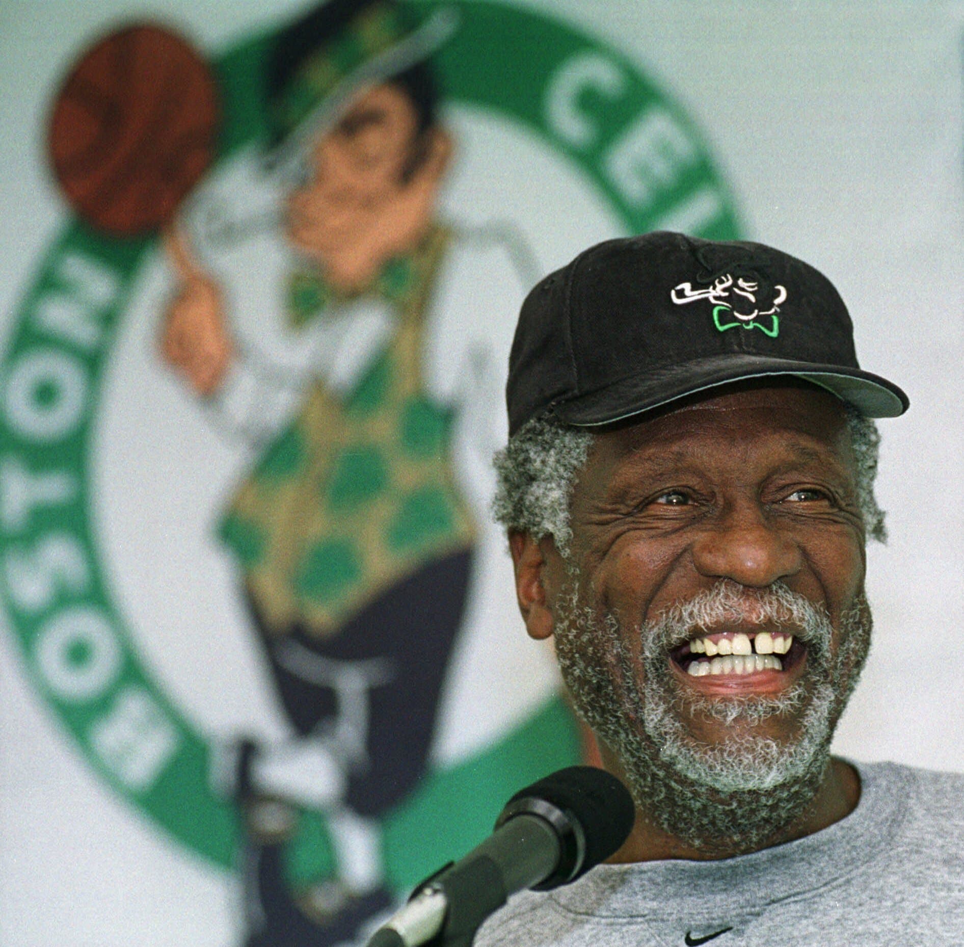 Boston Celtics legendary center Bill Russell answers questions from members of the media after a Celtics team practice in Waltham, Massachusetts on Oct. 11, 1999. (Angela Rowlings/AP)
