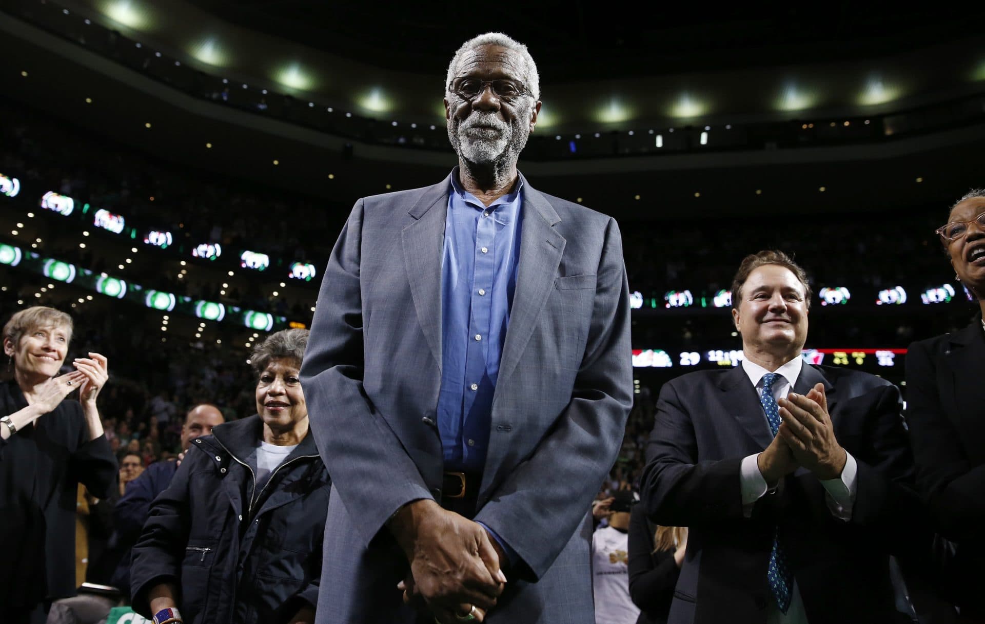 Bill Russell stands court side during a tribute in his honor in the second quarter of an NBA basketball game against the Milwaukee Bucks in Boston on Nov. 1, 2013. (Michael Dwyer/AP)