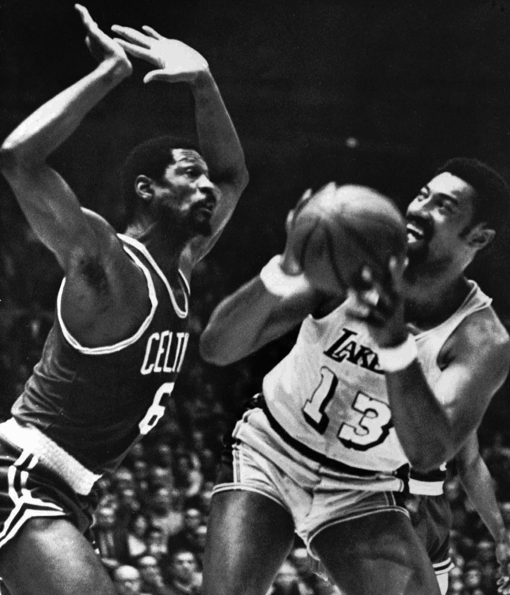In this May 5, 1969, file photo, Los Angeles Lakers' Wilt Chamberlain tries to shoot against Boston Celtics' Bill Russell during an NBA basketball finals game at the Forum in Los Angeles. (AP)