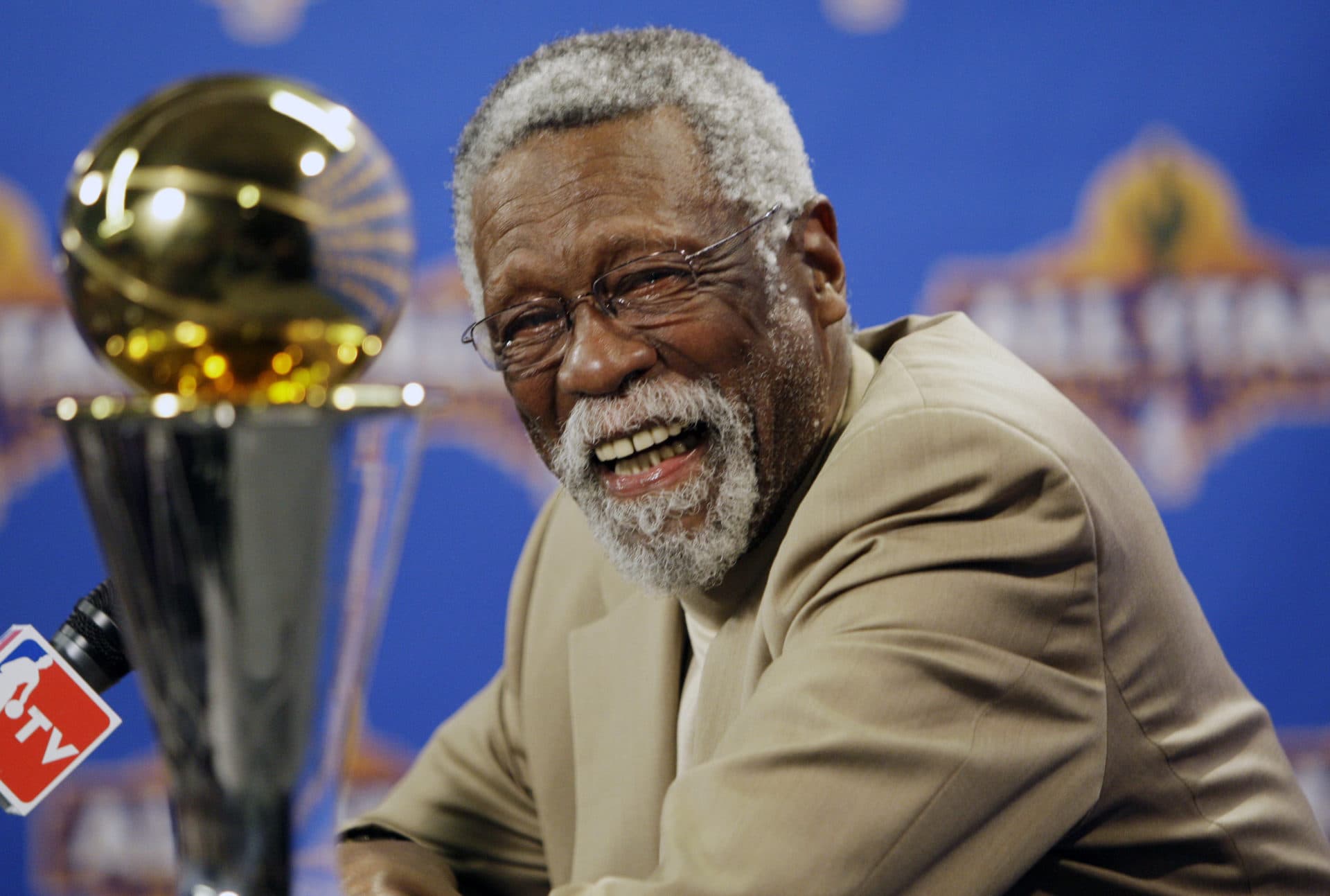 NBA great Bill Russell reacts at a news conference as he learns the most valuable player award for the NBA basketball championships has been renamed the Bill Russell NBA Finals Most Valuable Player Award, Feb. 14, 2009, in Phoenix. (Matt York/AP)