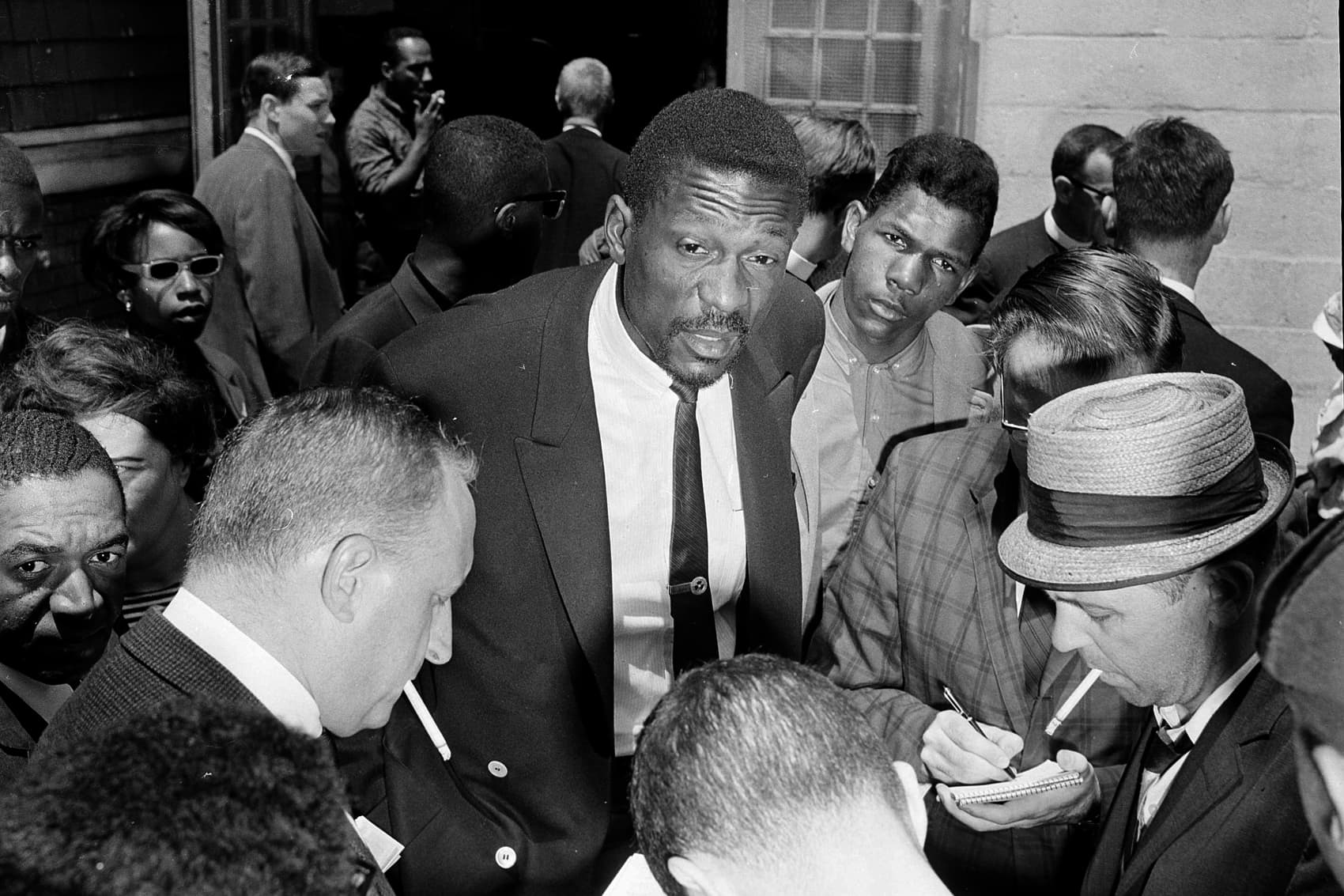 Bill Russell speaks with reporters about a boycott of public schools to protest segregation in June 1963. (Frank Curtin/AP)