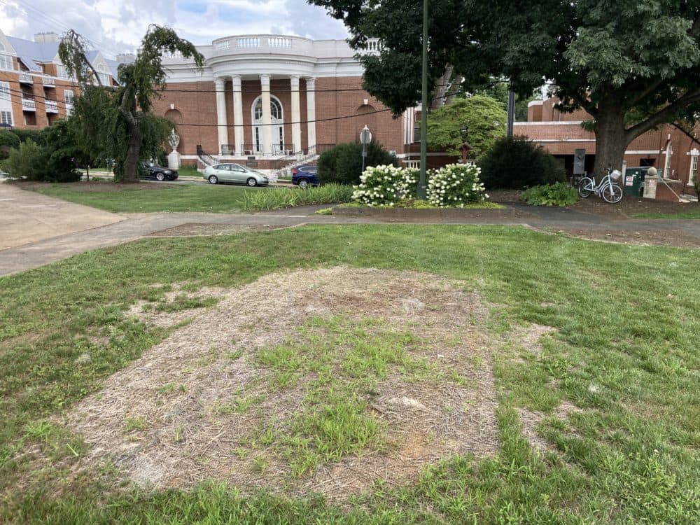 A patch of dead grass marks where the Robert E. Lee statue once stood. The statue’s fate is currently tied up in the courts. (Hawes Spencer)