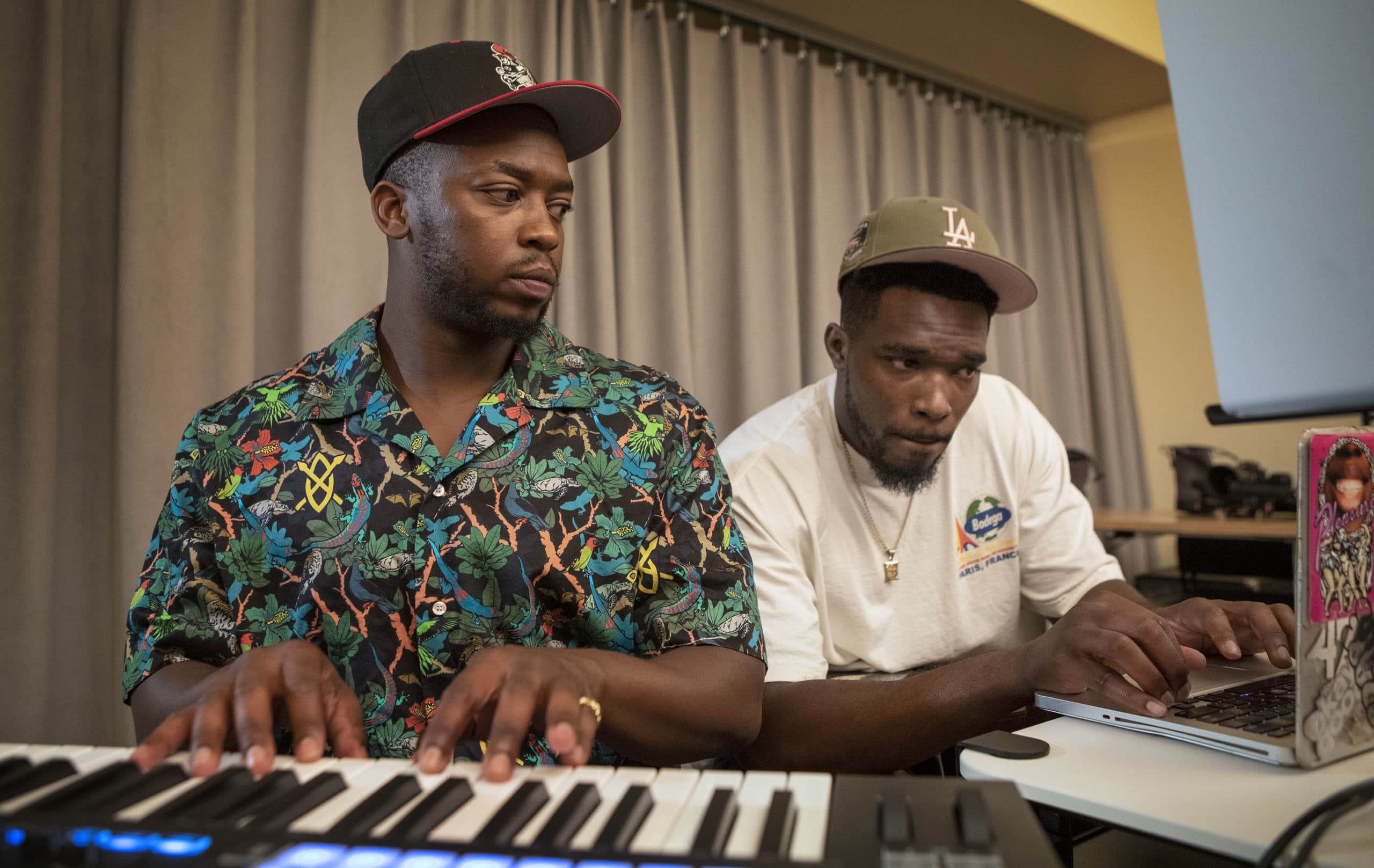 SuperSmashBroz Muyi Fre$co and Noma Nomz work on a track at The Record Co. in Boston. (Robin Lubbock/WBUR)