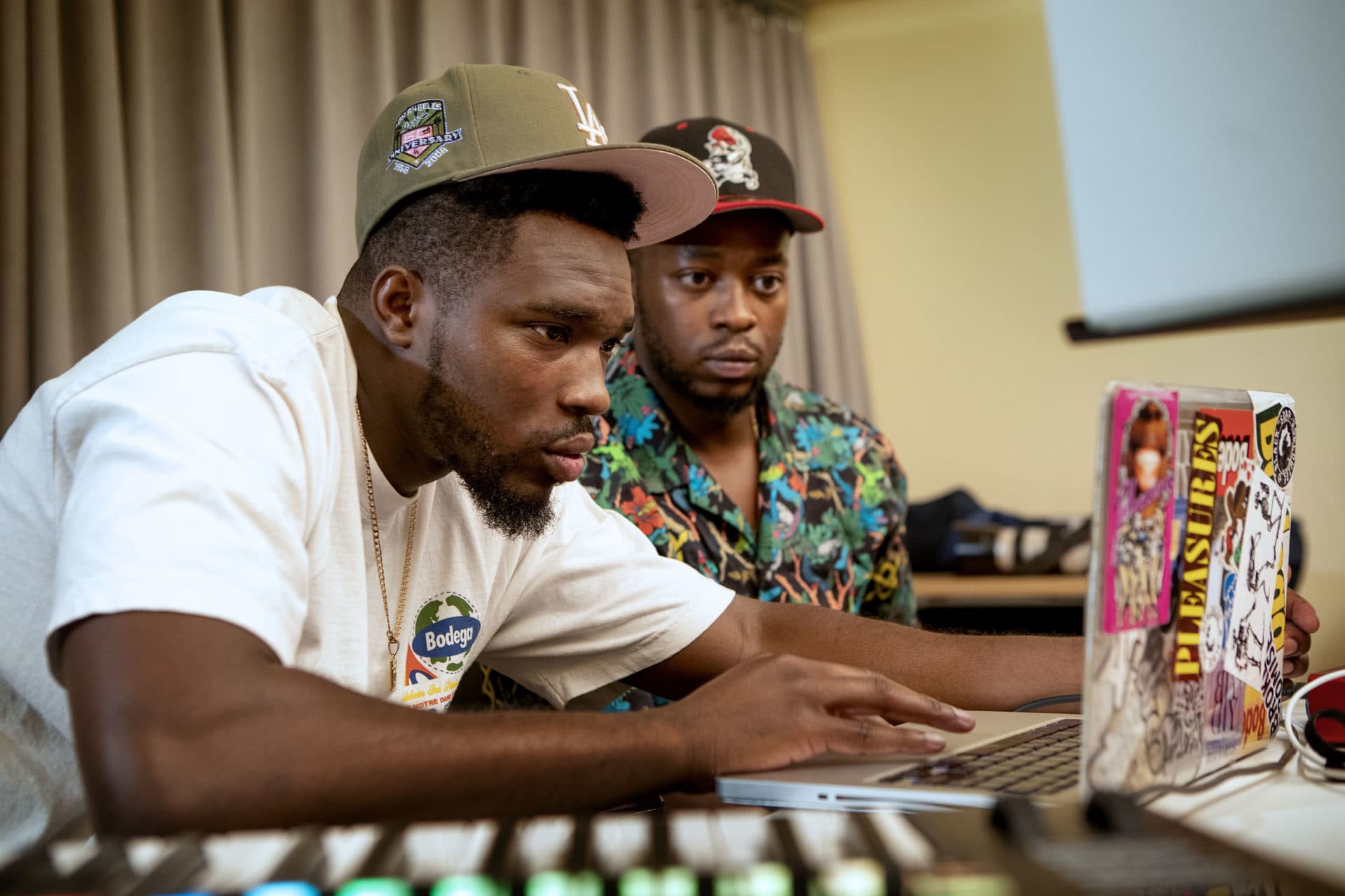 SuperSmashBroz Noma Nomz and Muyi Fre$co work on a track at The Record Co. in Boston. (Robin Lubbock/WBUR)