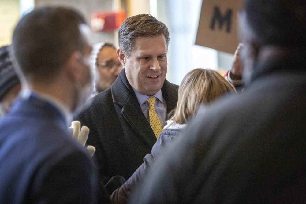 Geoff Diehl talks with protesters against proof of vaccination requirements at Boston City Hall. (Robin Lubbock/WBUR)