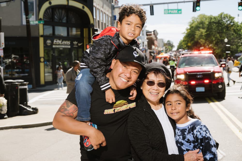 An Duong, center, poses with his family during a "Beautiful Dot" portrait session outside of the Boston Public Library Field's Corner branch on Sept. 24. (Courtesy Mike Ritter)