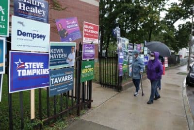 Massachusetts voters make their way to polls for primary election amid heavy rain