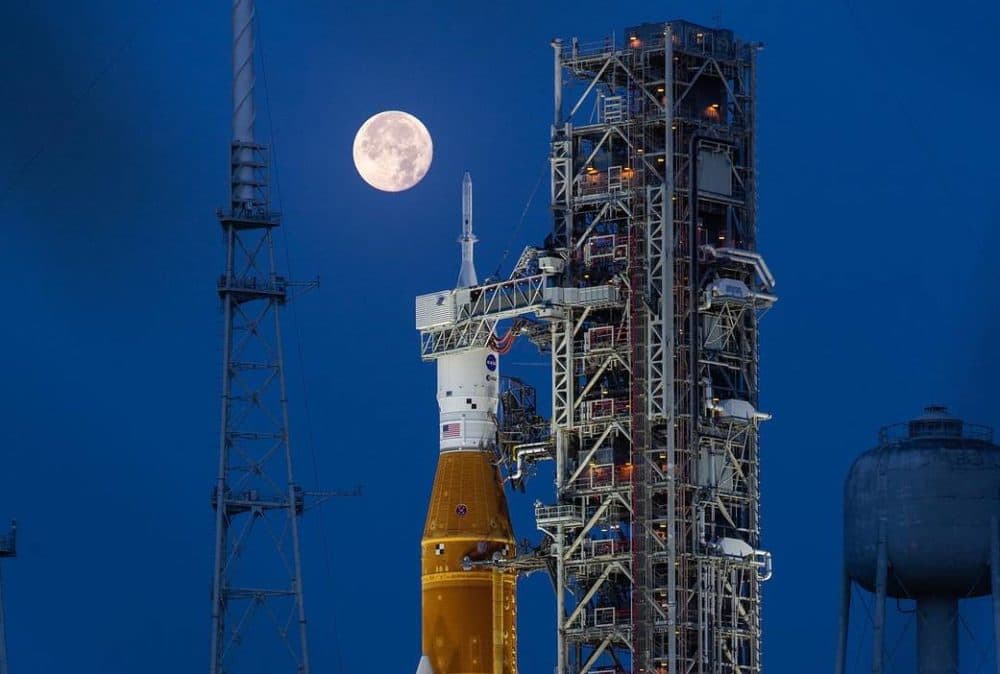 A full moon hangs over NASA's Artemis. (NASA)