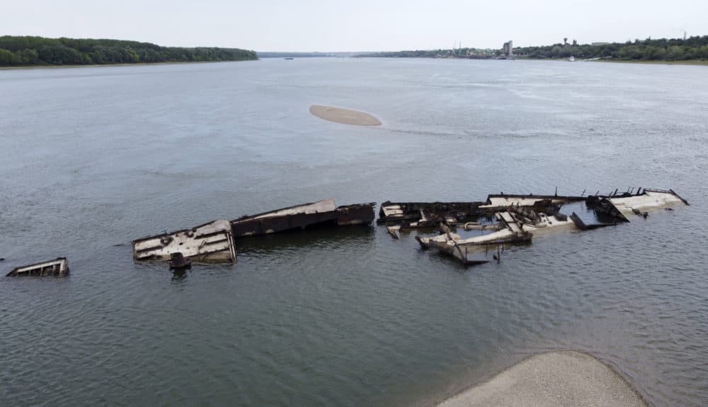 The wreckage of a WWII German warship is seen in the Danube river near Prahovo, Serbia, Monday, Aug. 29, 2022. The worst drought in Europe in decades has not only scorched farmland and hampered river traffic, it also has exposed a part of World War II history that had almost been forgotten. The hulks of dozens of German battleships have emerged from the mighty Danube River as its water levels dropped. (Darko Vojinovic/AP)v