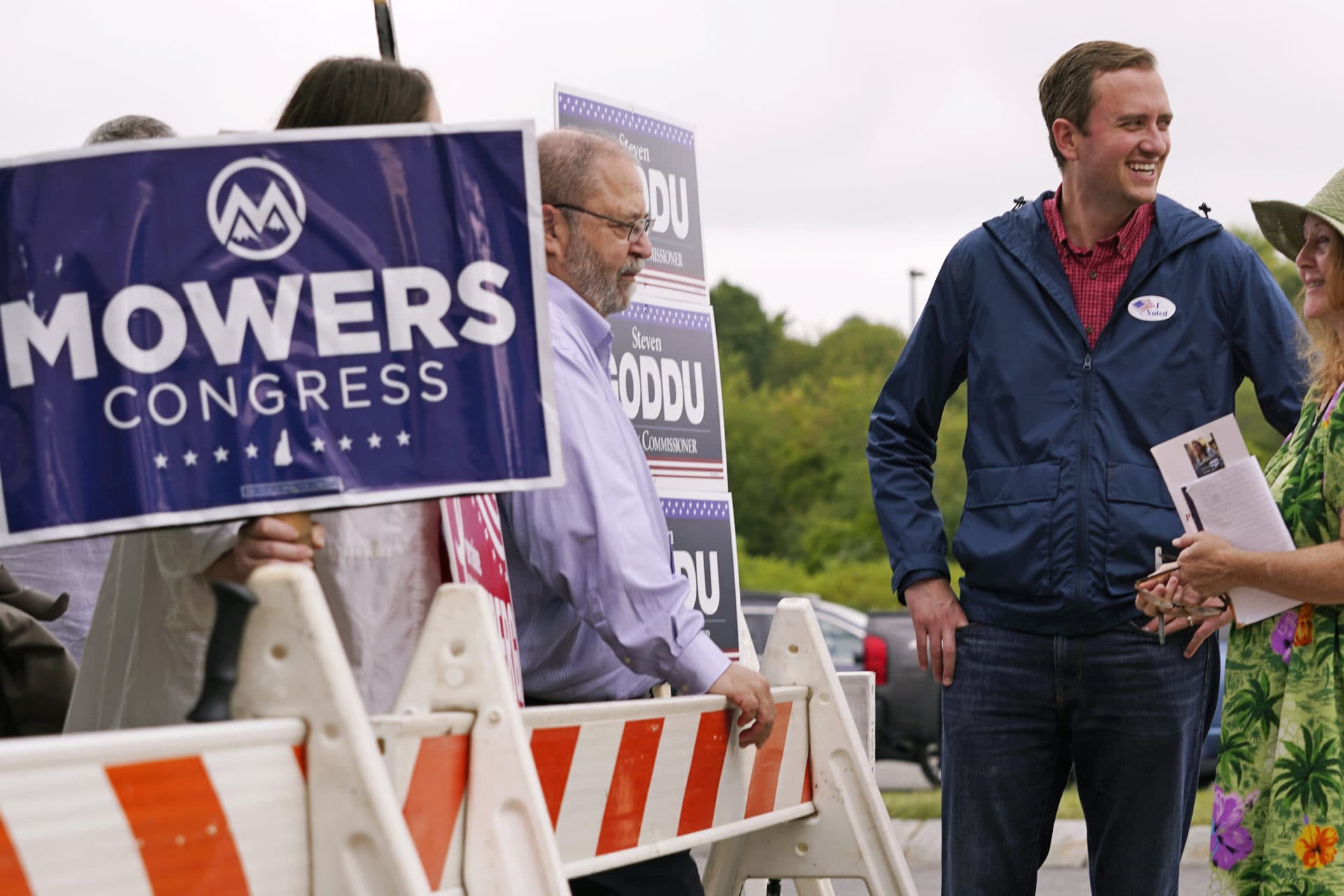 New Hampshire Republican 1st Congressional District Candidate Matt Mowers smiles while waiting to greet voters, Sept. 13, 2022, during a campaign stop at a polling station in Derry, N.H. (Charles Krupa/AP)