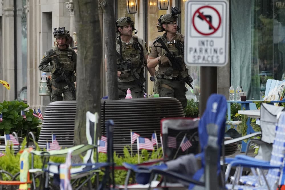 Law enforcement search after a mass shooting at the Highland Park Fourth of July parade in downtown Highland Park, Ill., a Chicago suburb, July 4, 2022. (Nam Y. Huh/AP File)