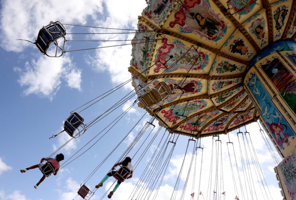 People took flight on an amusement ride at the Big E in West Springfield, MA on September 23, 2021. (Jessica Rinaldi/The Boston Globe via Getty Images)