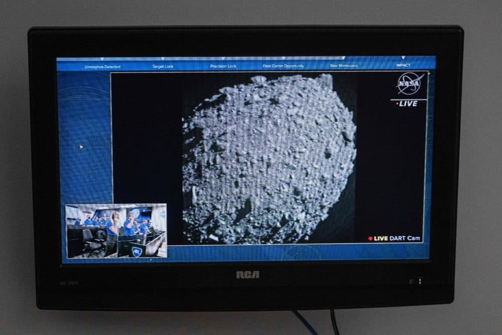 A television at NASA's Kennedy Space Center in Cape Canaveral, Florida, captures the final images from the Double Asteroid Redirection Test (DART) just before it smashes into the asteroid Dimorphos on Sept. 26. (Jim Watson/AFP via Getty Images)