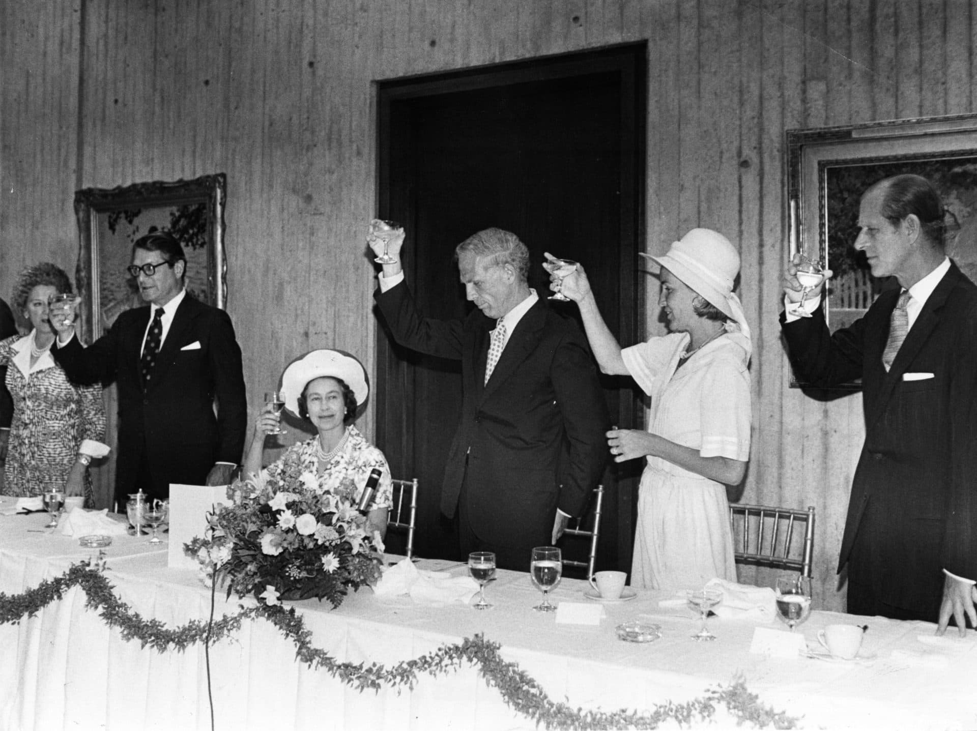 Queen Elizabeth II is toasted at a luncheon at Boston City Hall during her visit to Boston, July 11, 1976. Prince Philip is at right. (Charles Dixon/The Boston Globe via Getty Images)