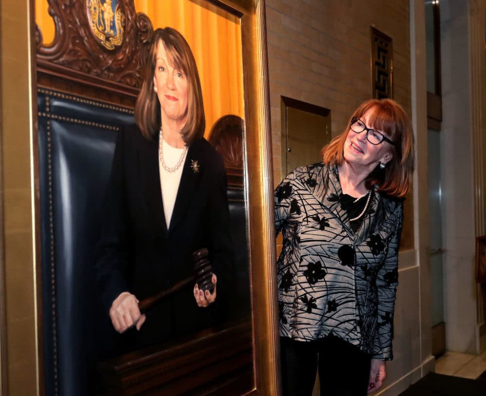Former Senate President Therese Murray stands next to her newly-unveiled official Senate portrait at the Great Hall in the Massachusetts State House in Boston on Nov. 2, 2017. (Barry Chin/The Boston Globe via Getty Images)