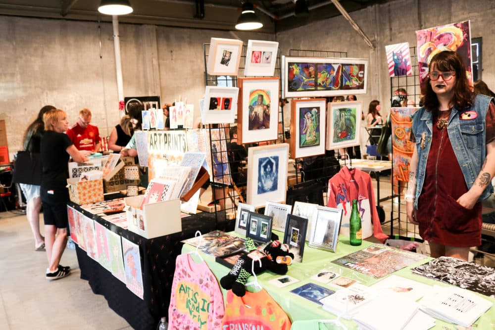 Artists sell their work during Industry Night at Garage B in Brighton. (Olivia Deng for WBUR)