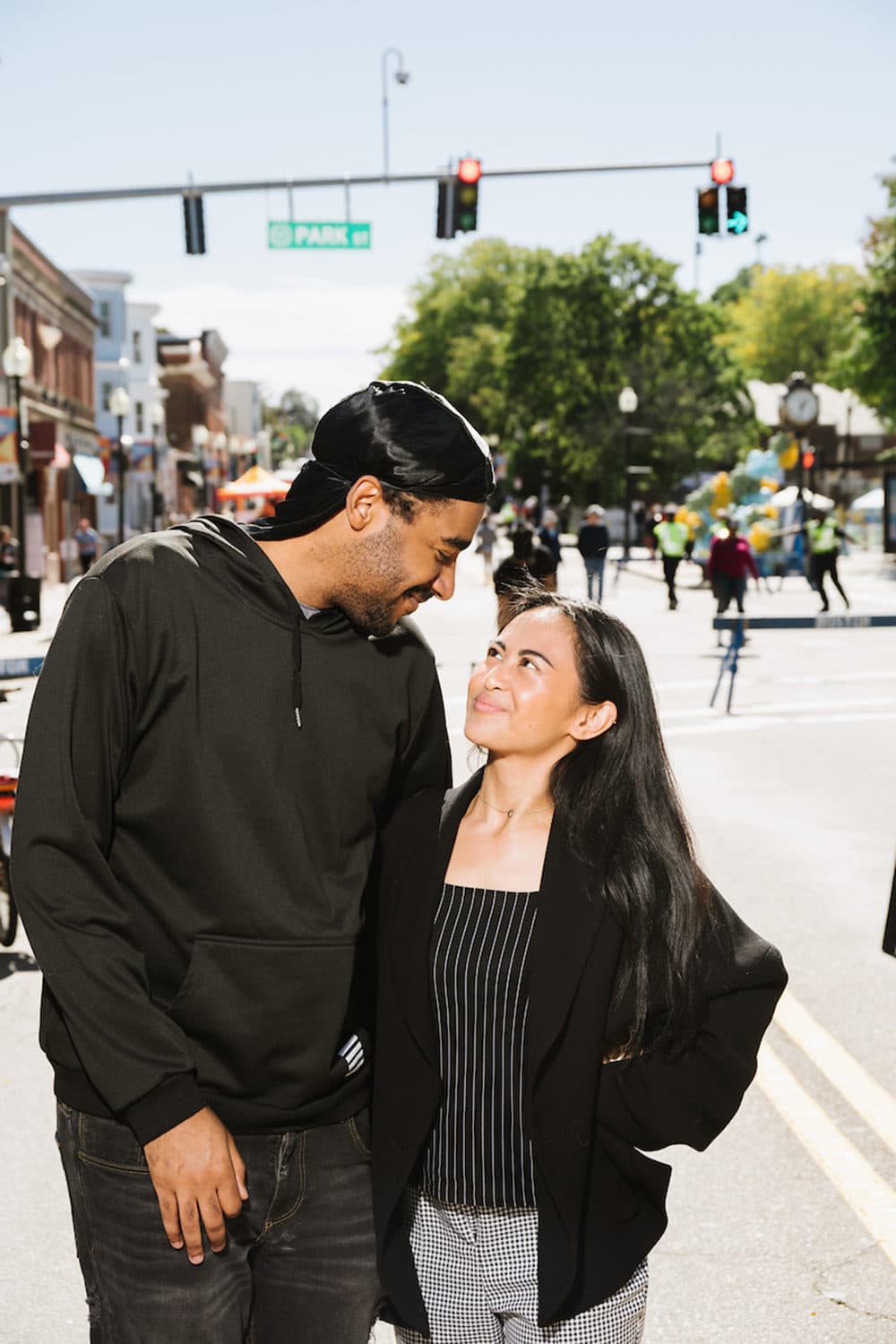 Tashawn Taylor and Hanna Enoy pose outside the Boston Public Library Field's Corner branch on Sept. 24 as part of the &quot;Beautiful Dot&quot; project. (Courtesy Mike Ritter)