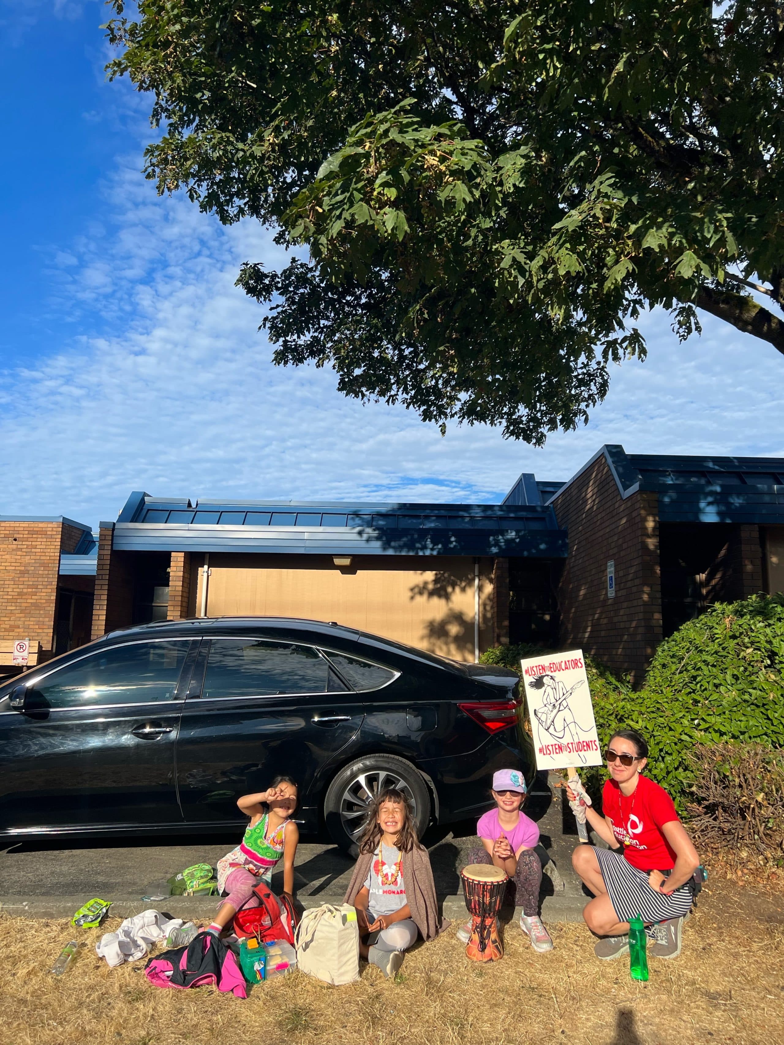 Rebecca Chen-Chase with her daughter Ruth Chen (far left) and two other kids on the picket line who are entering 2nd and 1st grade at Seattle Public Schools. (Courtesy of Rebecca Chen-Chase) 