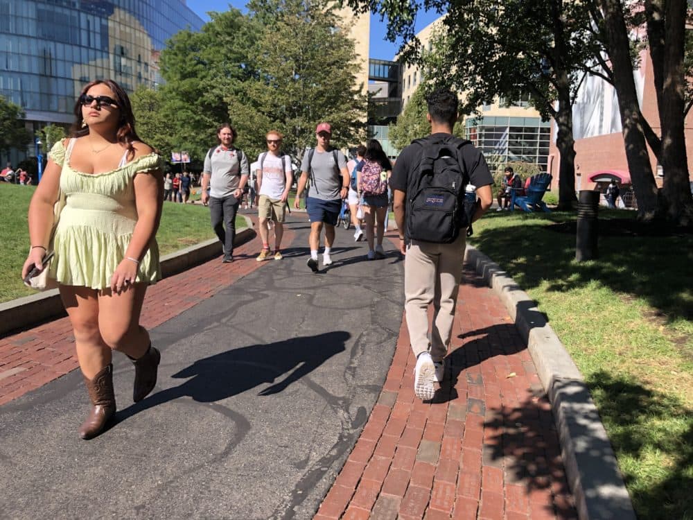 Students walk across campus at Northeastern University on Sept. 14, 2022, the day after an explosive package was found near campus. (Carrie Jung/WBUR)