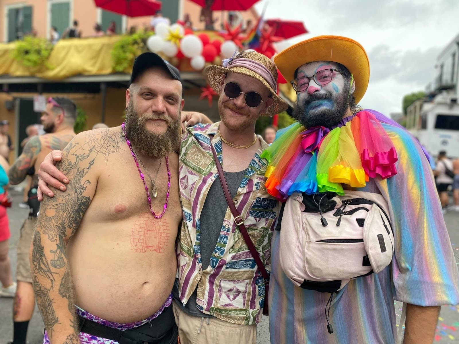 Shea Creel (left), Jae Hinton (center), and Darryn Johnson (right) stop for a photo in New Orleans’ French Quarter, Sept. 6, 2022. The trio from Lake Charles, Louisiana were excited to come to Southern Decadence and were happy to see positive messaging around monkeypox vaccinations. (Shalina Chatlani/ Gulf States Newsroom.)