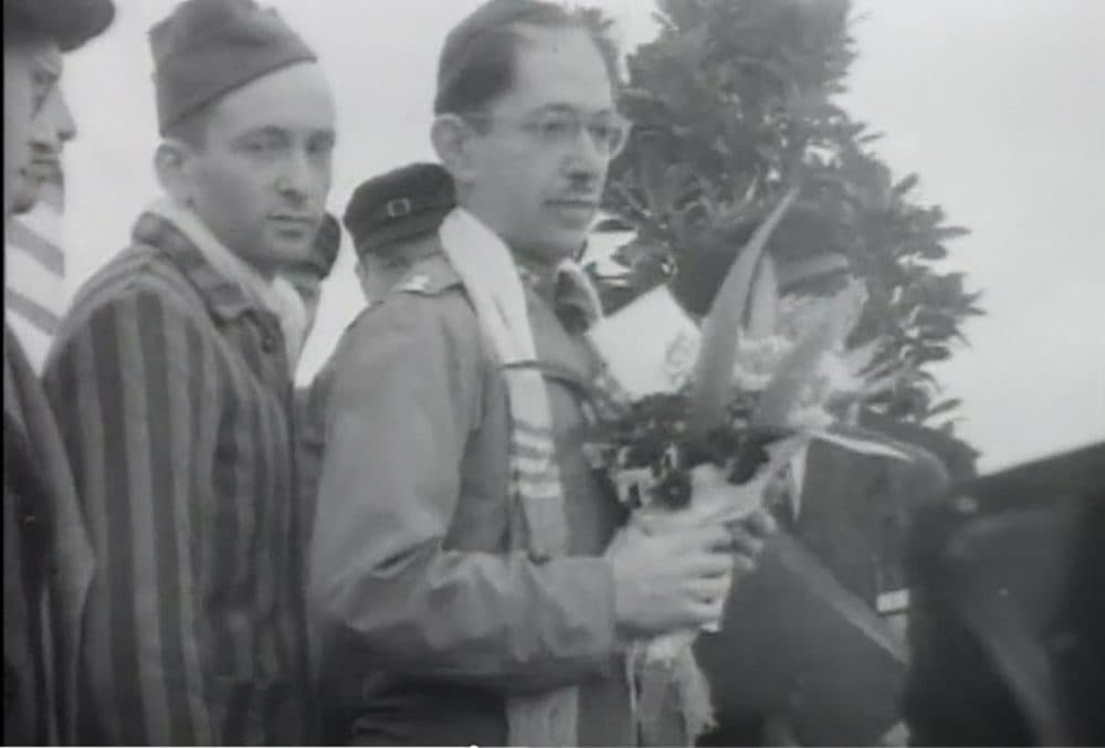 The author's grandfather, Mietek, pictured behind the rabbi, in the third episode of "The U.S. and the Holocaust." (Courtesy Karen Kirsten)