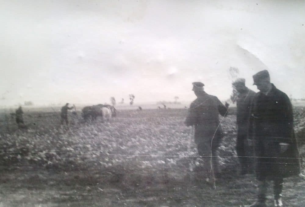 The author's grandfather, an SS "Special driver for goods," wearing the dark cloak in the foreground.  Photo taken in occupied Poland circa 1940/1941.  (Courtesy private collection)