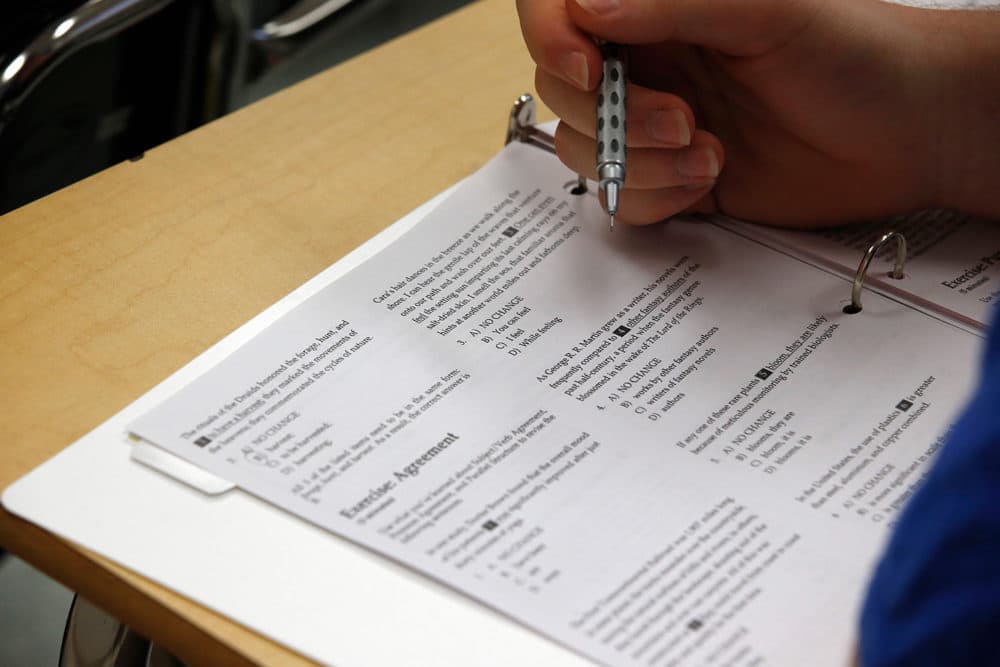 A student looks at questions during a college test preparation class. (Alex Brandon/AP)