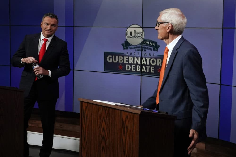 Wisconsin Republican gubernatorial candidate Tim Michels, left, and Democratic gubernatorial candidate Tony Evers talk before a televised debate Friday, Oct. 14, 2022, in Madison, Wis. (Morry Gash/AP)