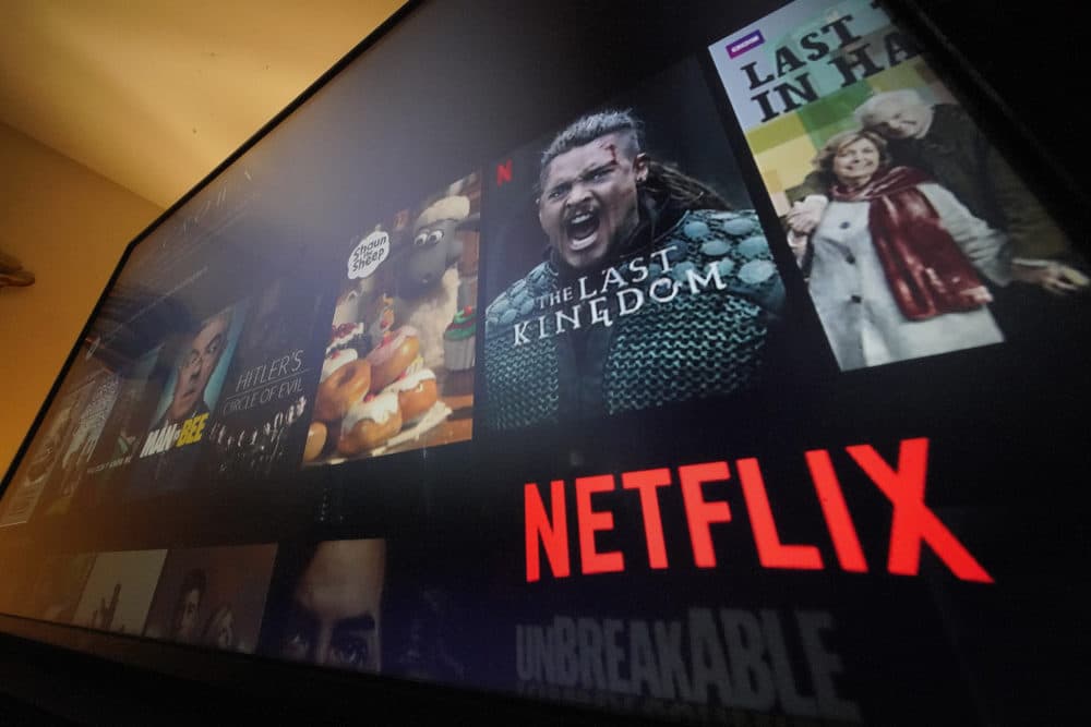 The Netflix menu is shown on a screen. (Gene J. Puskar/AP)