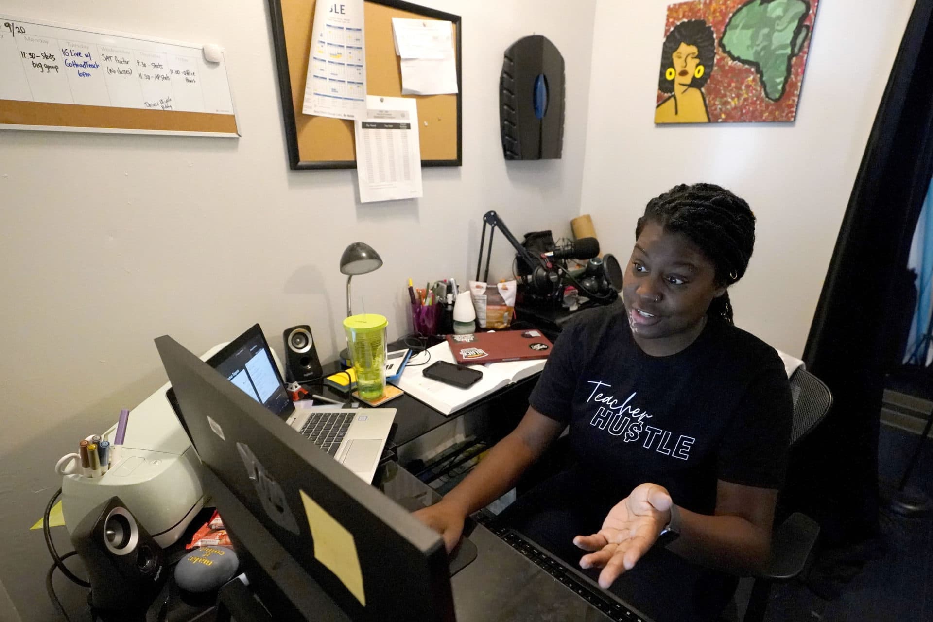 FILE - Chicago charter school teacher Angela McByrd works on her laptop to teach remotely from her home in Chicago, Sept. 24, 2020. (Nam Y. Huh/AP)