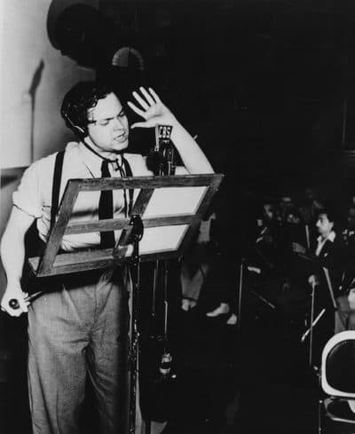 Orson Welles broadcasts his radio show of H.G. Wells' science fiction novel &quot;The War of the Worlds&quot; in a New York studio at 8 p.m., Sunday, Oct. 30, 1938. The realistic account of an invasion from Mars caused thousands of listeners to panic. (AP Photo)