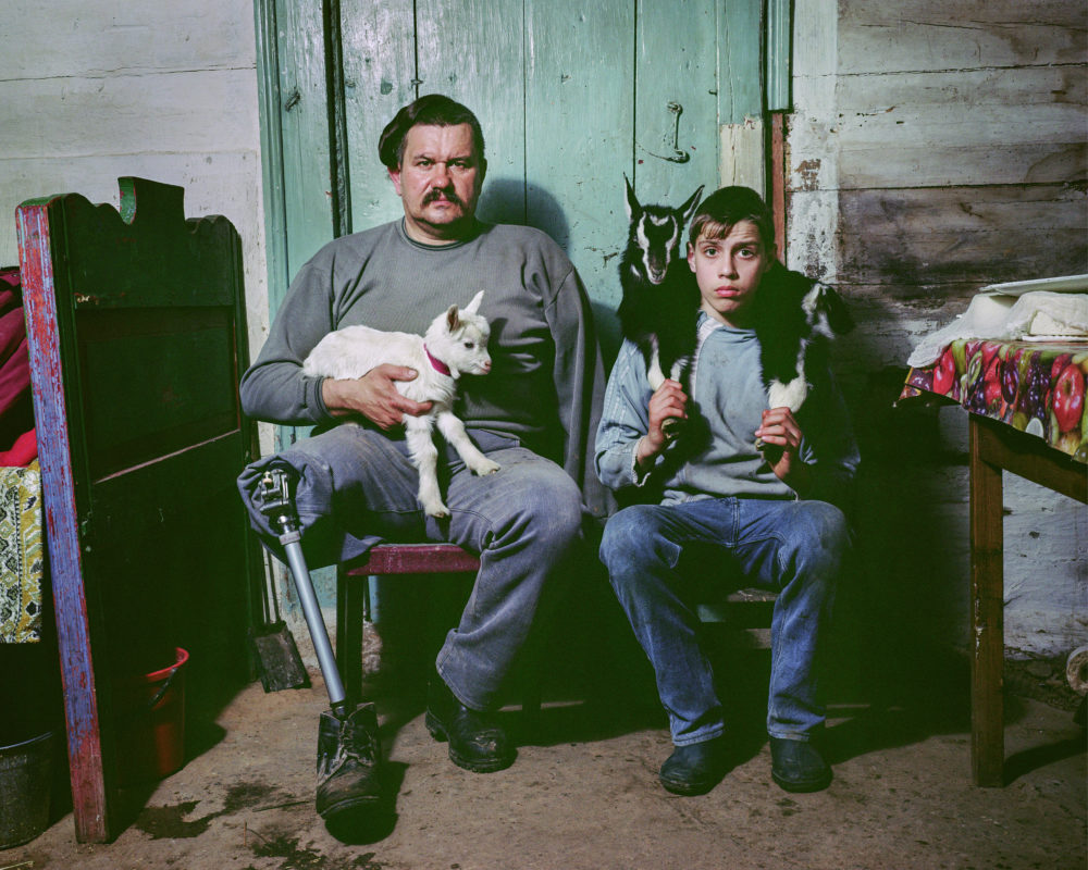 Aleksander and Sasha on his goat farm in Zhytomir. (Mark Neville)