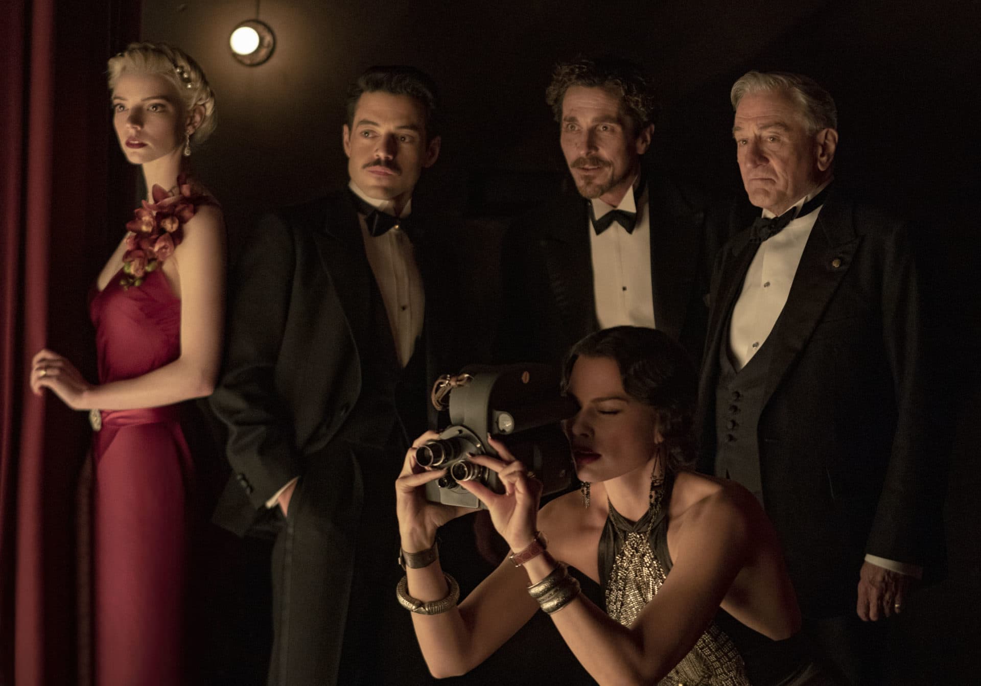 Left to right: Anya Taylor-Joy as Libby, Rami Malek as Tom, Christian Bale as Burt, Robert De Niro as Gil, and Margot Robbie as Valerie 